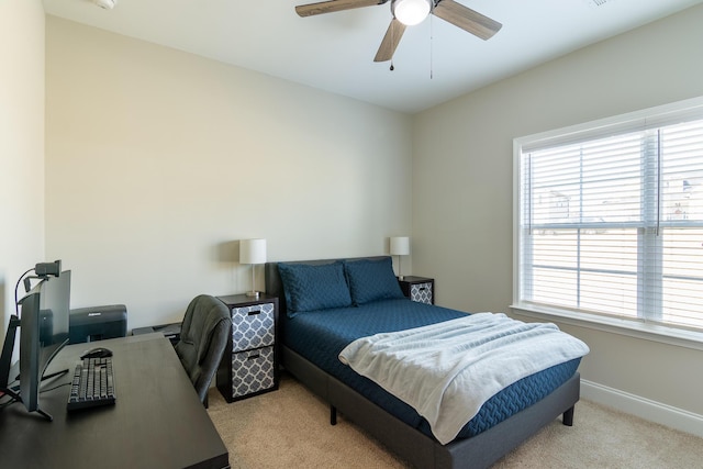 bedroom featuring carpet floors, a ceiling fan, and baseboards