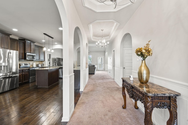 5315 Bull St, Augusta, GA 30909 - corridor with dark wood finished floors, recessed lighting, a chandelier, arched walkways, and ornamental molding