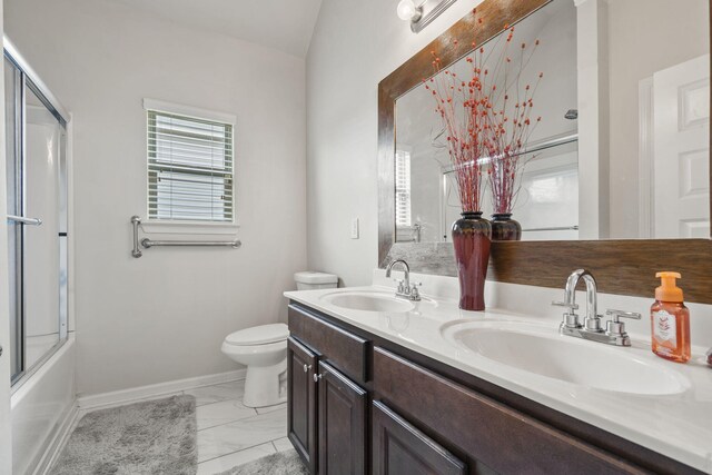 5315 Bull St, Augusta, GA 30909 - full bath featuring marble finish flooring, double vanity, and shower / bath combination with glass door