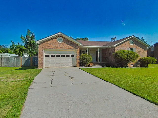 4373 Quail Creek Rd, Martinez, GA 30907 - ranch-style home with brick siding, an attached garage, concrete driveway, and covered porch