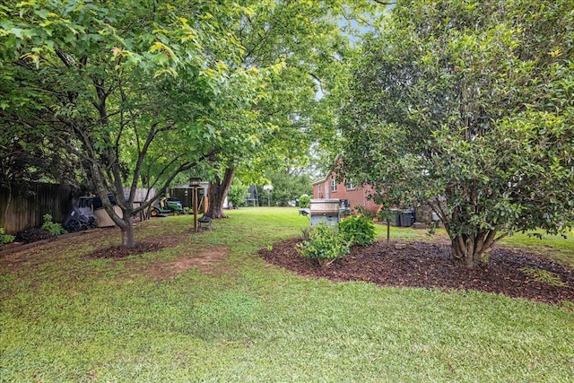 view of yard with a playground and fence