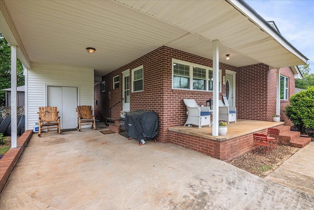 view of patio / terrace featuring a carport, grilling area, and covered porch