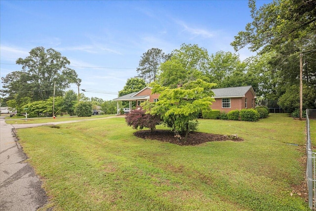 view of yard featuring aphalt driveway