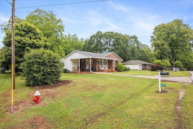 ranch-style home with covered porch and a front yard