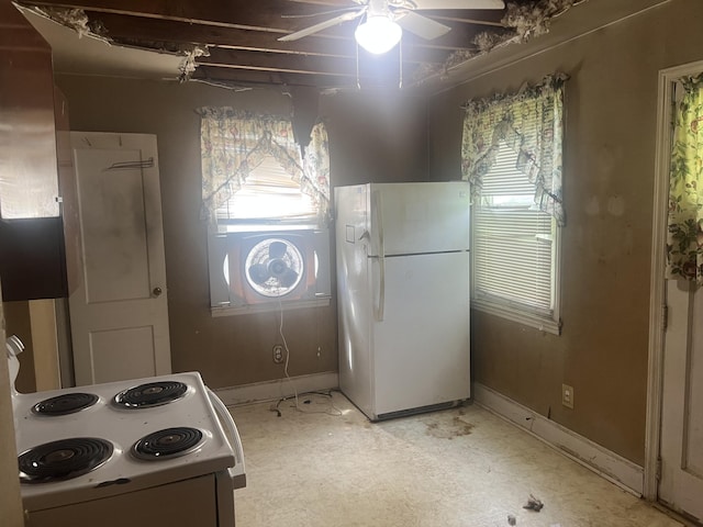 824 Ann St, Augusta, GA 30904 - kitchen featuring white appliances and a ceiling fan