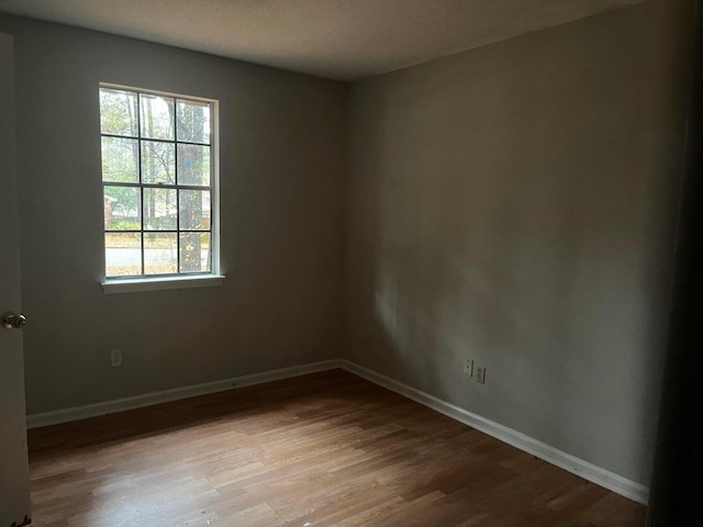 unfurnished room featuring light hardwood / wood-style flooring