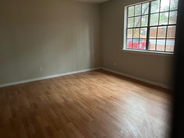 unfurnished room featuring light hardwood / wood-style floors