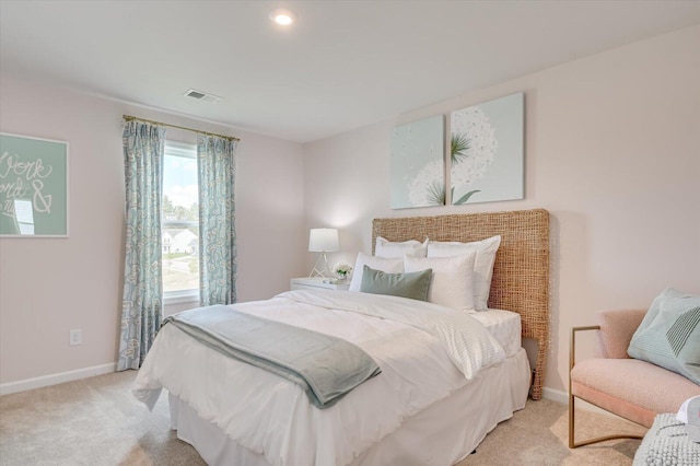 bedroom featuring light carpet