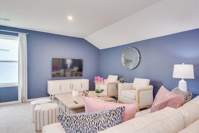 living room with light carpet and vaulted ceiling