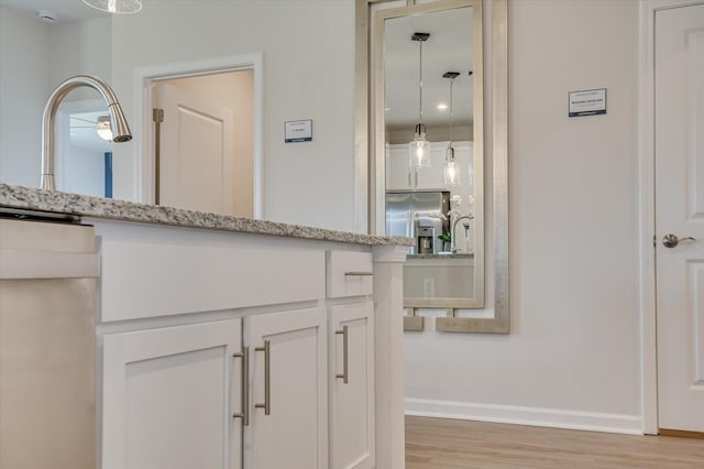 bathroom with wood-type flooring