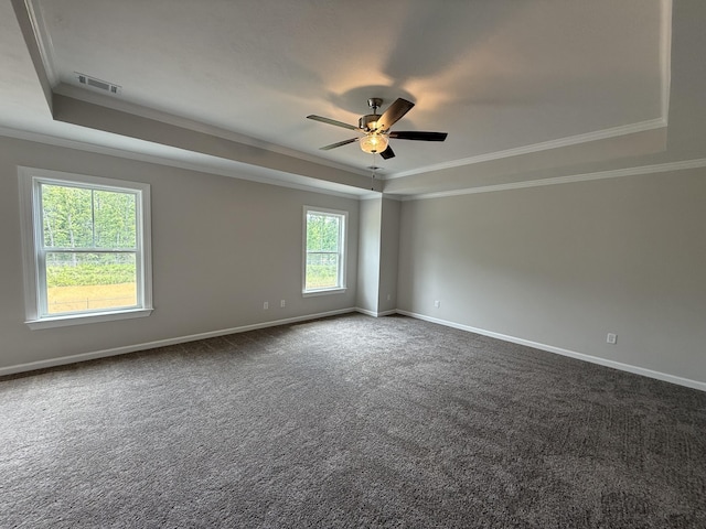 251 Prominence Dr, Grovetown, GA 30813 - spare room featuring a tray ceiling, crown molding, a ceiling fan, and dark carpet