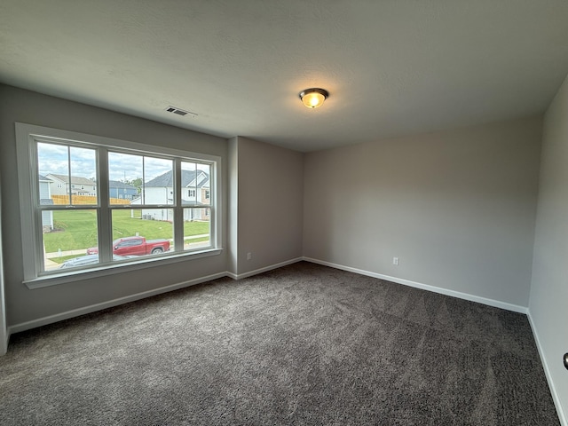 251 Prominence Dr, Grovetown, GA 30813 - empty room with dark carpet and baseboards