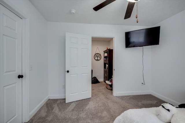 carpeted bedroom with ceiling fan