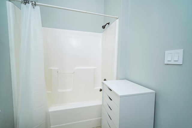 bathroom with vanity and shower / bath combination with curtain