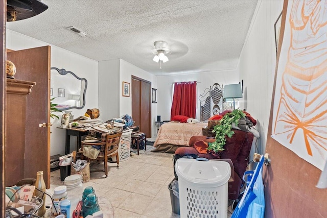 interior space with ceiling fan and a textured ceiling