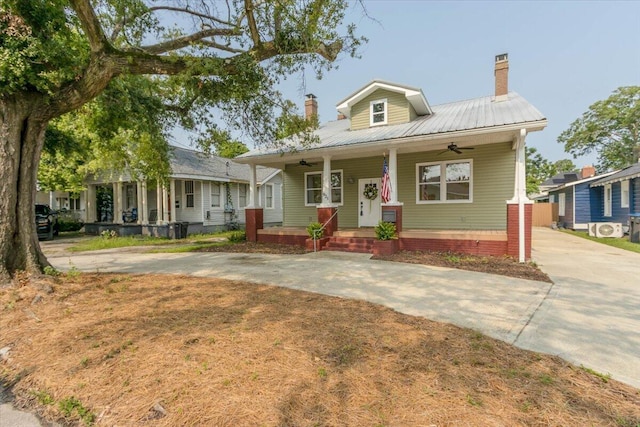 925 Beman St, Augusta, GA 30904 - view of front of property featuring ceiling fan, covered porch, a chimney, metal roof, and concrete driveway
