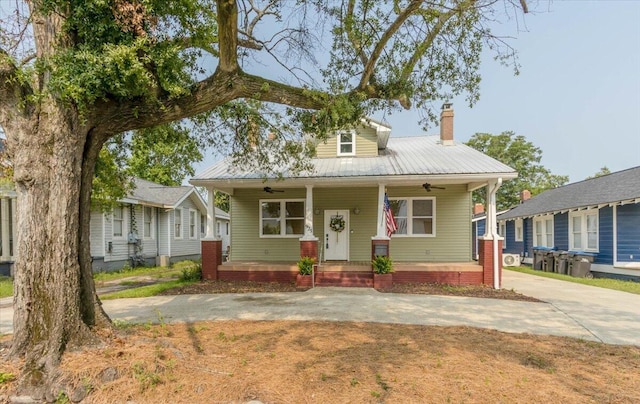 925 Beman St, Augusta, GA 30904 - view of front facade with ceiling fan, metal roof, covered porch, and a chimney