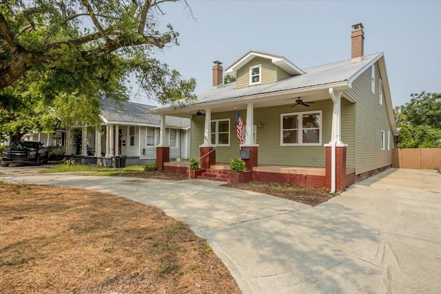 925 Beman St, Augusta, GA 30904 - bungalow-style house featuring a porch, a ceiling fan, a chimney, and concrete driveway