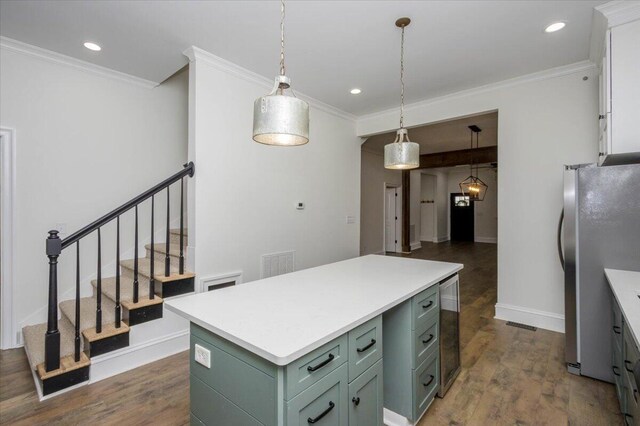 925 Beman St, Augusta, GA 30904 - kitchen with green cabinetry, freestanding refrigerator, wine cooler, a center island, and dark wood-type flooring