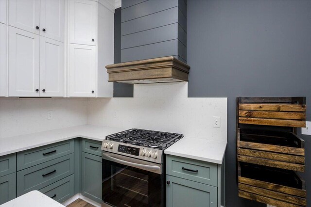 925 Beman St, Augusta, GA 30904 - kitchen featuring stainless steel gas stove, wine cooler, light countertops, and backsplash