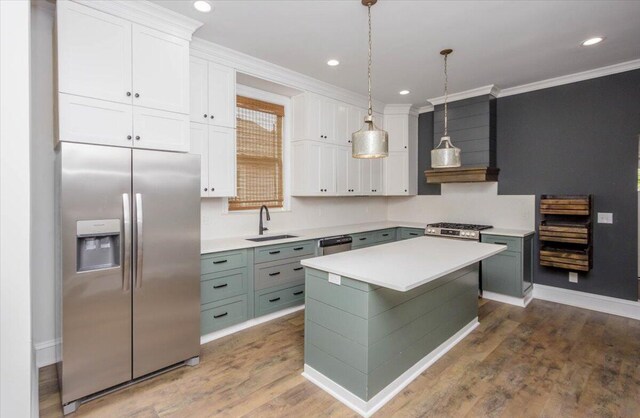 925 Beman St, Augusta, GA 30904 - kitchen with appliances with stainless steel finishes, a sink, custom range hood, light countertops, and white cabinetry