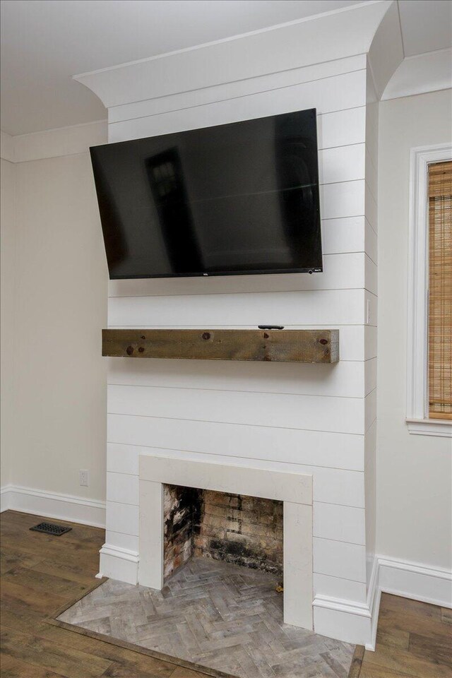 925 Beman St, Augusta, GA 30904 - detailed view of a fireplace, baseboards, and wood finished floors