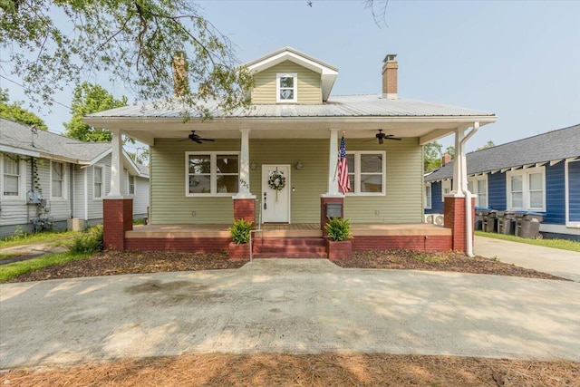 925 Beman St, Augusta, GA 30904 - view of front facade with ceiling fan, covered porch, metal roof, and a chimney