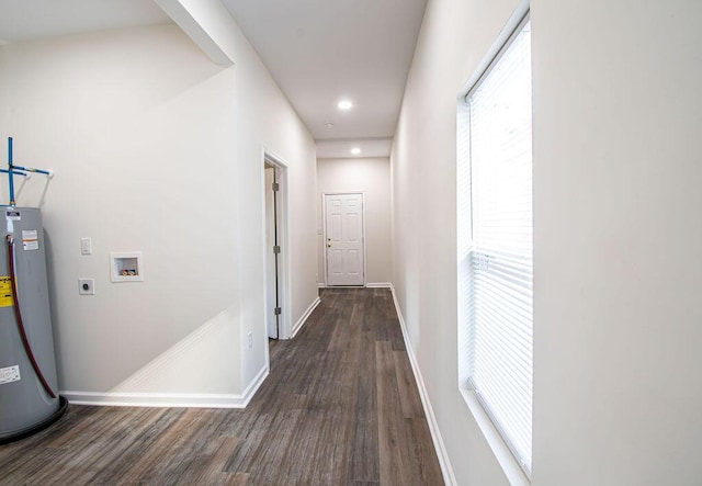 hall featuring dark hardwood / wood-style flooring and gas water heater