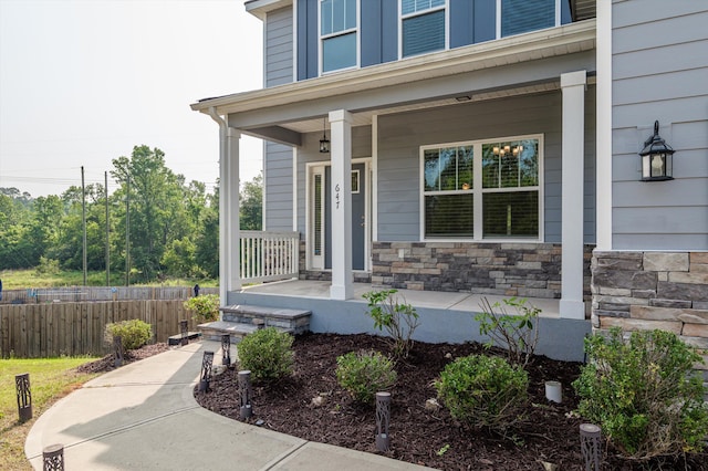 647 Bunchgrass St, Evans, GA 30809 - view of exterior entry featuring a porch and stone siding