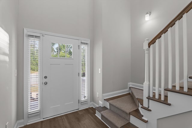 647 Bunchgrass St, Evans, GA 30809 - entrance foyer featuring stairway, dark wood finished floors, a high ceiling, and baseboards