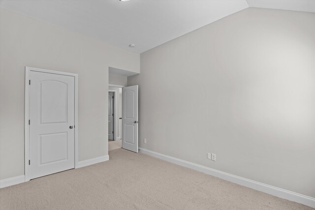 647 Bunchgrass St, Evans, GA 30809 - unfurnished bedroom featuring carpet, baseboards, and lofted ceiling
