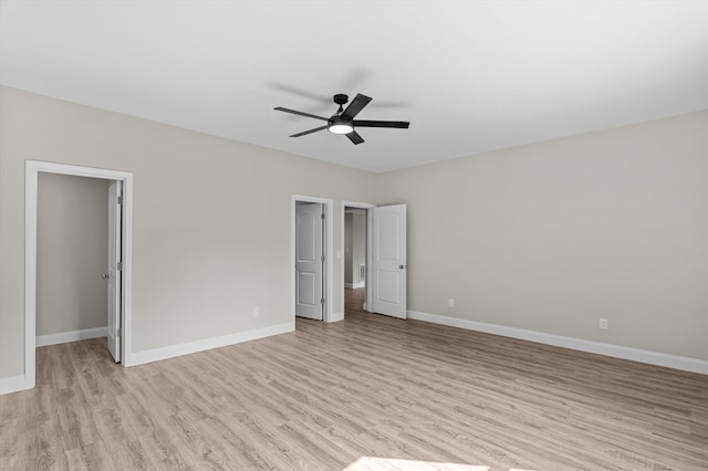647 Bunchgrass St, Evans, GA 30809 - unfurnished bedroom featuring light wood-type flooring, a spacious closet, baseboards, ceiling fan, and a closet