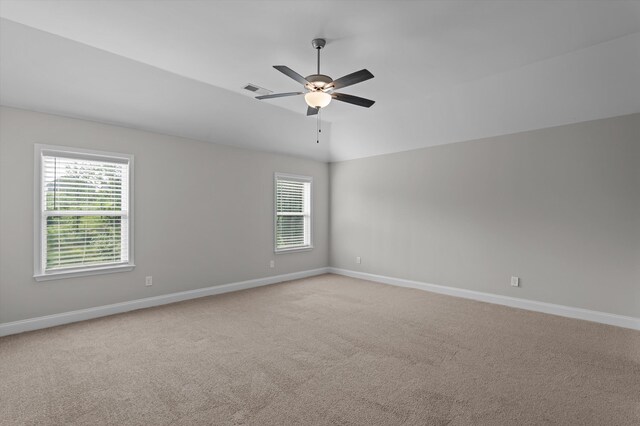 647 Bunchgrass St, Evans, GA 30809 - empty room with baseboards, light colored carpet, a ceiling fan, and vaulted ceiling