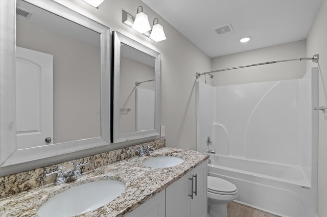 647 Bunchgrass St, Evans, GA 30809 - bathroom featuring double vanity, bathing tub / shower combination, toilet, and wood finished floors