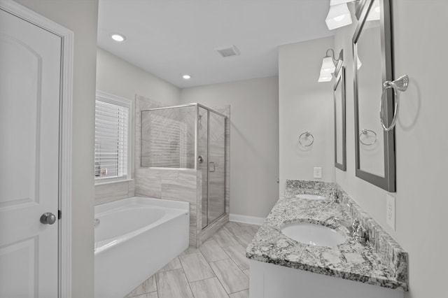 647 Bunchgrass St, Evans, GA 30809 - bathroom with a garden tub, a stall shower, double vanity, recessed lighting, and marble finish floors
