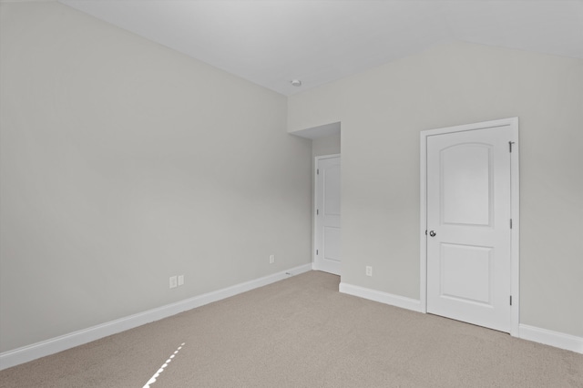 647 Bunchgrass St, Evans, GA 30809 - unfurnished bedroom featuring vaulted ceiling, light colored carpet, and baseboards