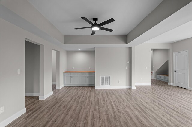 647 Bunchgrass St, Evans, GA 30809 - unfurnished living room with ceiling fan, light wood-style floors, and baseboards