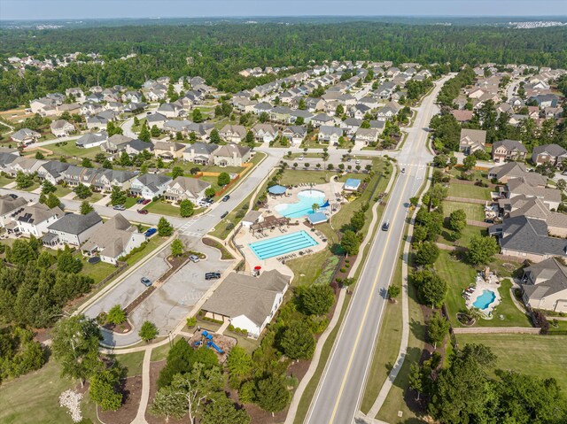 647 Bunchgrass St, Evans, GA 30809 - view of property location with a pool, nearby suburban area, and a heavily wooded area