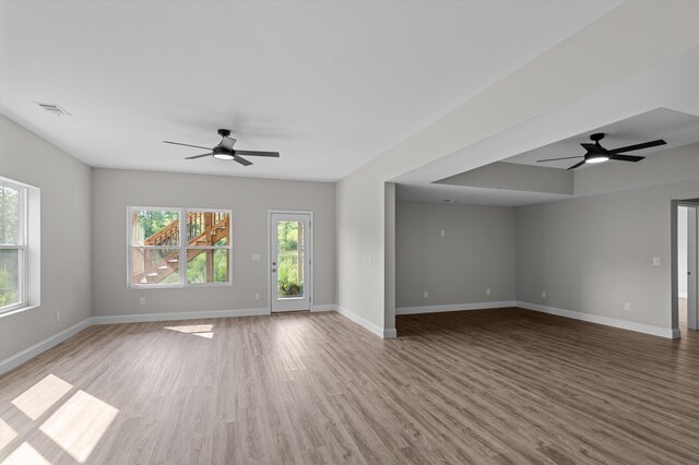 647 Bunchgrass St, Evans, GA 30809 - spare room with a ceiling fan, wood finished floors, and baseboards