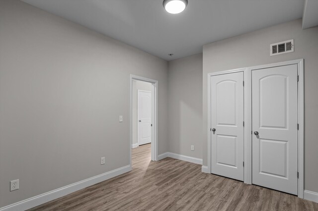 647 Bunchgrass St, Evans, GA 30809 - unfurnished bedroom featuring light wood-type flooring and baseboards