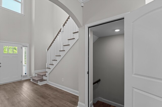 647 Bunchgrass St, Evans, GA 30809 - entrance foyer featuring dark wood finished floors, baseboards, a towering ceiling, and stairs