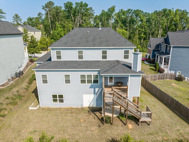 647 Bunchgrass St, Evans, GA 30809 - rear view of house featuring a shingled roof, stairway, and a wooden deck