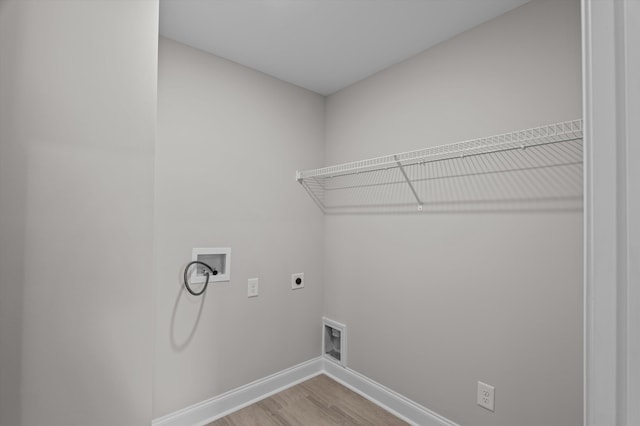 647 Bunchgrass St, Evans, GA 30809 - washroom featuring hookup for an electric dryer, hookup for a washing machine, light wood-style flooring, and baseboards