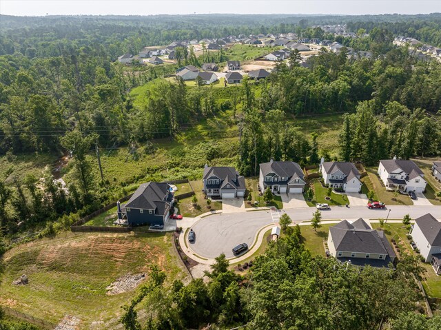 647 Bunchgrass St, Evans, GA 30809 - aerial overview of property's location featuring nearby suburban area and a forest