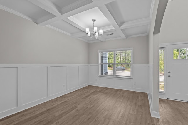 647 Bunchgrass St, Evans, GA 30809 - entrance foyer with a decorative wall, a chandelier, coffered ceiling, beamed ceiling, and wood finished floors