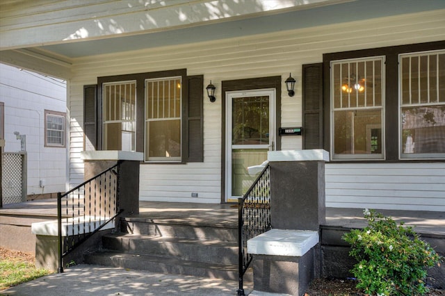 doorway to property featuring a porch