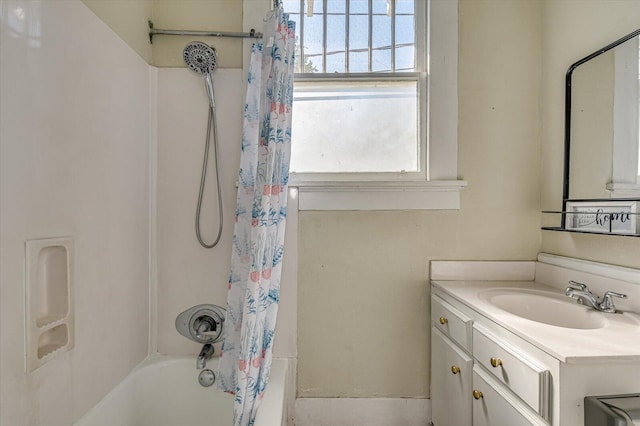 bathroom with shower / bath combo with shower curtain and vanity