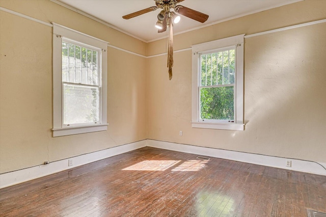 spare room featuring ceiling fan, dark hardwood / wood-style flooring, and ornamental molding