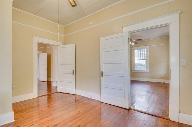 unfurnished bedroom with wood-type flooring and ornamental molding