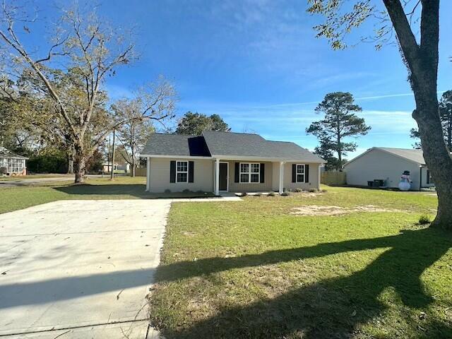 ranch-style house with a front lawn